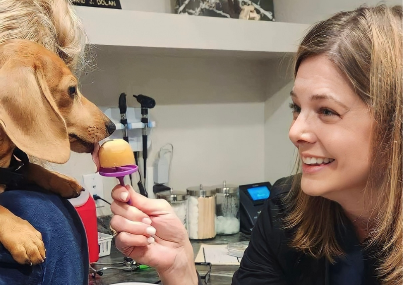 Carousel Slide 6: Dr. Wilson sharing her famous pupsicles!